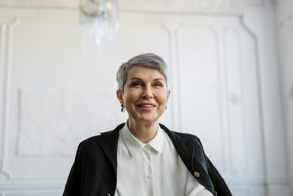 woman middle aged smiling modern interior professional photography.png