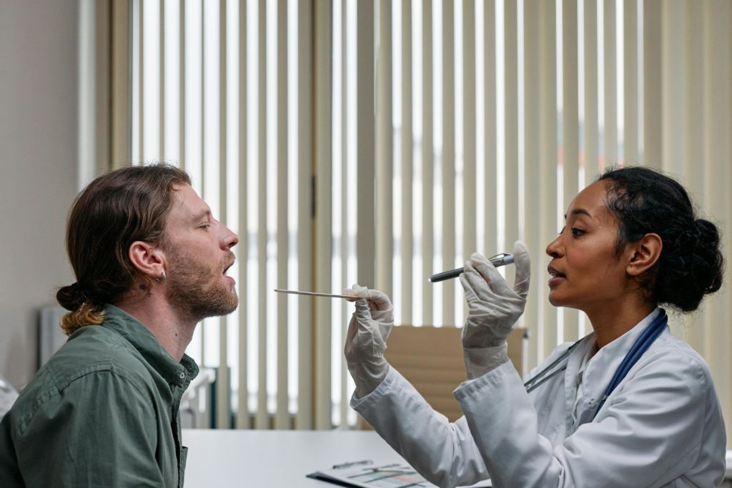 doctor examining patient cough professional photography modern interior aesthetic.jpg